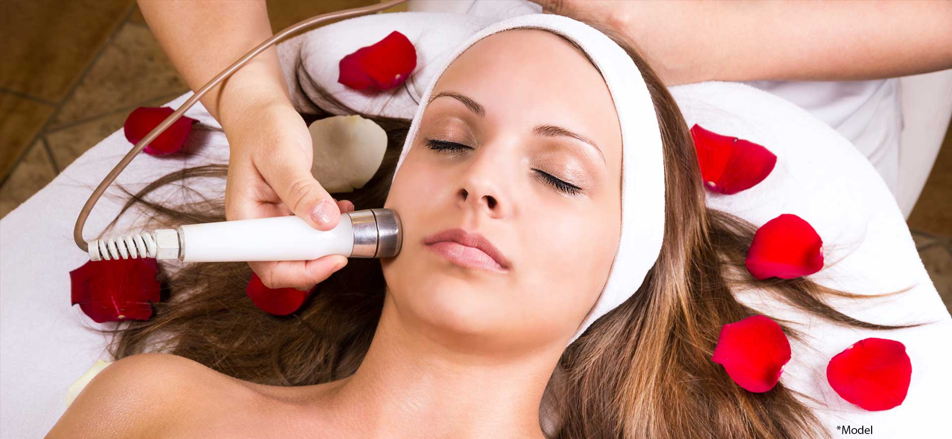 Woman getting laser and ultrasound face treatment