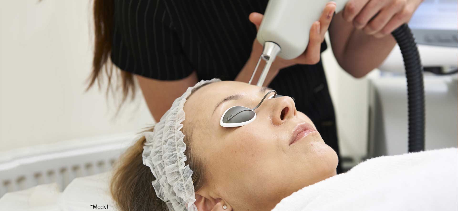 Beautician Carrying Out Fractional Laser Treatment